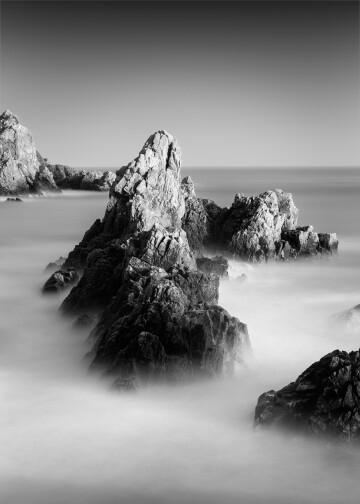 amazing-grayscale-shot-rocky-beach-guernsey.jpg